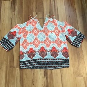 Skies are Blue off the shoulder blouse in a size small.